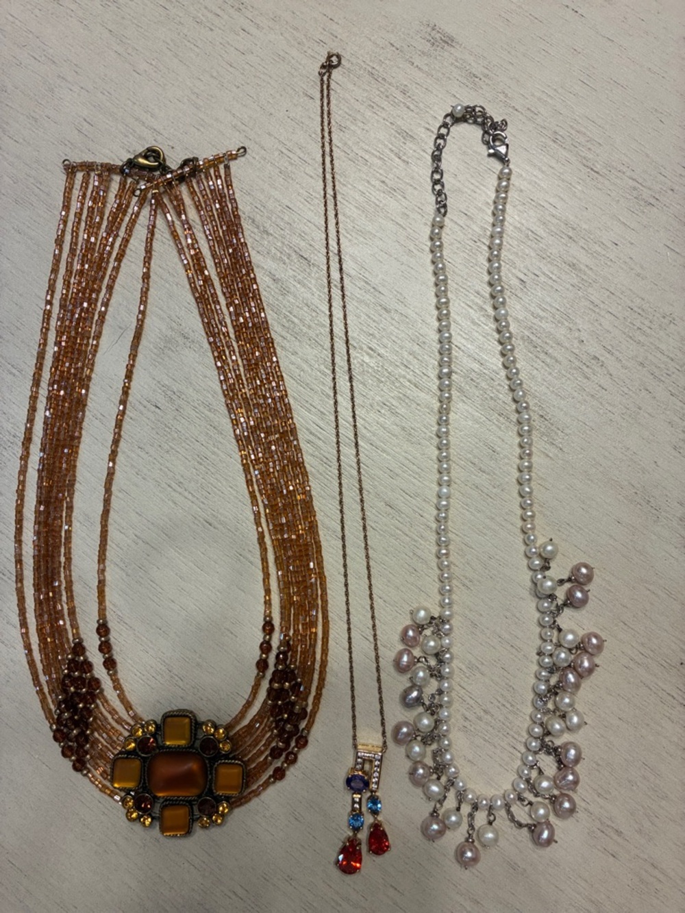 Multi-Strand Amber, pearl, and single strand. Includes all three.